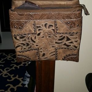 Brown leather cross body purse with concealed